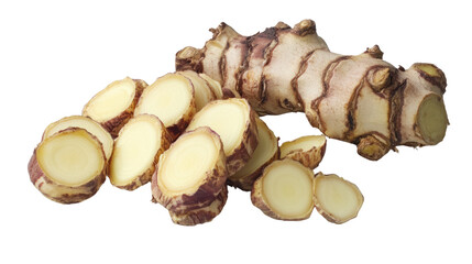 Fresh ginger root with sliced pieces displayed on a white background.
