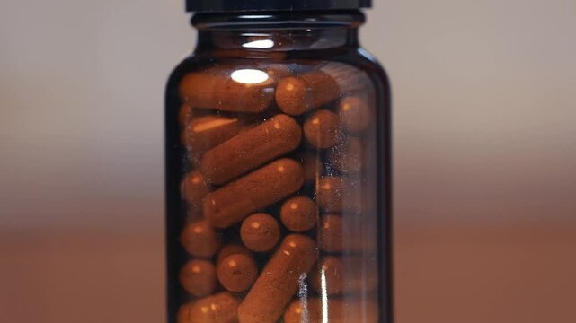 Drug pills spinning in a bottle
