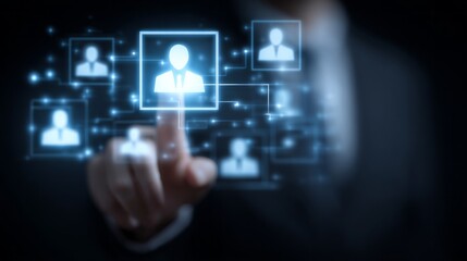 A man is pressing a button on a computer screen that has a group of people on it