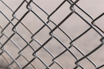 Fototapeta premium old wire mesh on dirty wall, construction industry