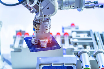 production of solar panels, Industrial robot working in factory,Conveyor Tracking Controller of robotic hand.
