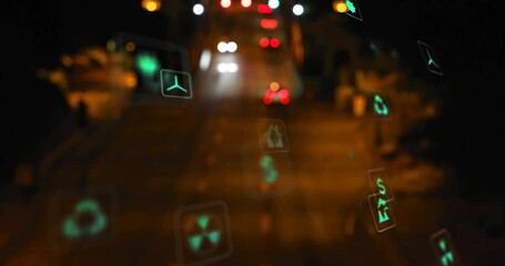 Icons fading in and drifting across night roadway showing green themes while cars passing behind