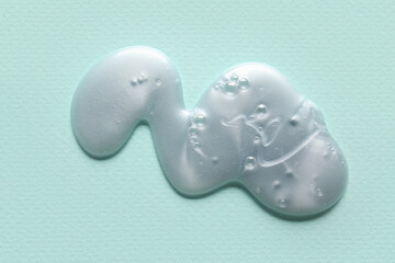Shower gel on color background