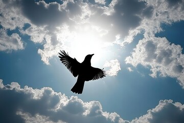 Fototapeta premium Silhouette of a bird flying with wings spread against a bright sun surrounded by scattered clouds in a blue sky