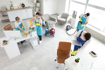 Group of janitors cleaning in office, top view
