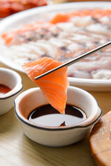 Dip the fish in soy sauce
