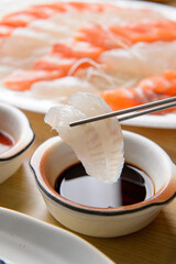 Dip the fish in soy sauce
