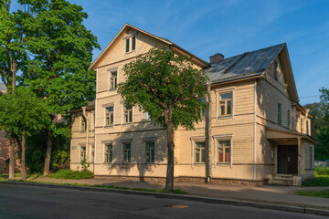 Old wooden apartment building, Pytnikova House, on Konyushennaya Street on a sunny summer day, Pavlovsk, St. Petersburg, Russia