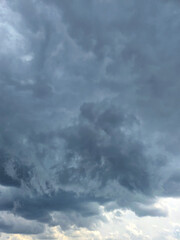 Dramatic Storm sky with dark blue and grey cumulus. Rainy clouds background texture. Just before the heavy rain or thunderstorm. dramatic dark clouds in the sky. Beautiful landscape with cloudy sky.