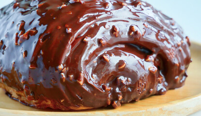 Close up Chocolate coated croissant with fudge chunks, Fresh baked made of croissant dough, sweet bakery pastry, specialty menu