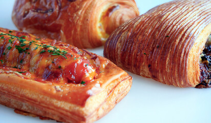 Close up Fresh baked appetizing various kind of croissants, pastry bakery made of croissant dough,...