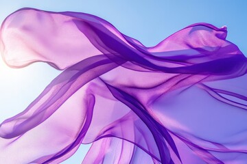Fototapeta premium Flowing purple fabric dances in the sunlight against a clear blue sky, Flowing purple fabric in bright sunlight, against clear blue sky