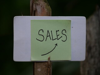 The word "sale" is boldly written on the hand, drawing attention for promotion purposes.