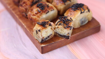 Jakarta's signature baked Bolen cake photographed at various angles of 45 degrees, front view and...