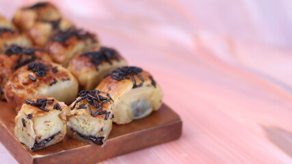 Jakarta's signature baked Bolen cake photographed at various angles of 45 degrees, front view and...