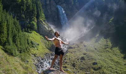 Man, breathing and relax with peace in nature. Meditation, spiritual wellness. Calm, athlete and freedom in environment. Training mindfulness. Relaxed man in nature. Freedom and happiness lifestyle.