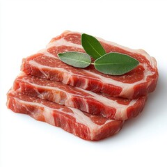 Three fresh raw pork ribeye steaks stacked with green herb leaves on top against a white background