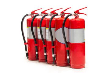 Row of red fire extinguishers lined up for safety in a commercial building corridor
