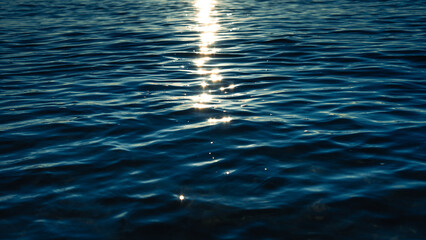 Dark ocean in early morning, dark blue waves with reflection,Backgrounds or marine themes