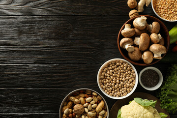 Set of vegan protein products on dark wooden background, space for text