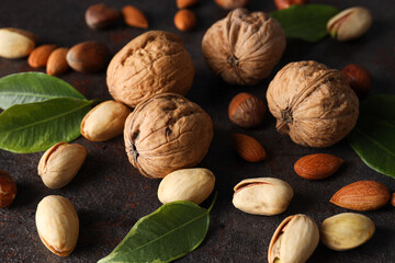 Different types of nuts on a dark background