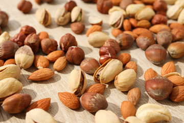 Assortment of different nuts on a wooden table