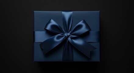 Photo of Dark Blue Gift Box with Satin Bow on Black Background