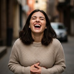 Photo of a Young Woman Laughing in a City Street