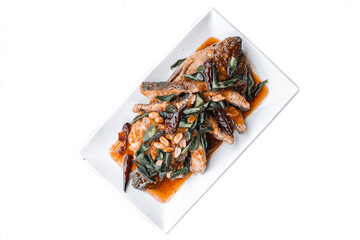 Delicious fries fish with chili and orange slices on white plate transparent background.