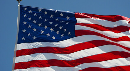 Obraz premium American Flag Waving in Blue Sky