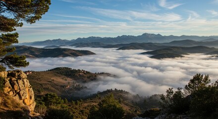 Photo of Foggy Valley and Distant Mountains in France