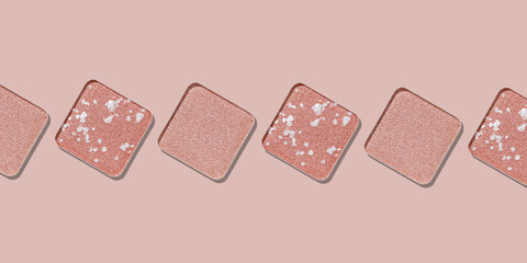 Cosmetics texture background, pale pink color eye shadow in row, square eye powder makeup swatches. Female cosmetic and beauty products, aesthetic minimal beauty banner, colorful eyeshade, top view