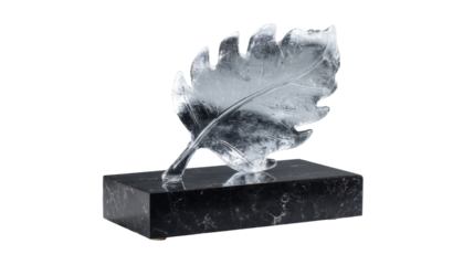 A stunning ice sculpture designed as a leaf on a black base. transparent background