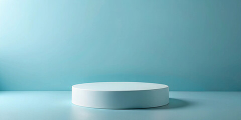Simple studio shot of a white round pedestal on a blue background