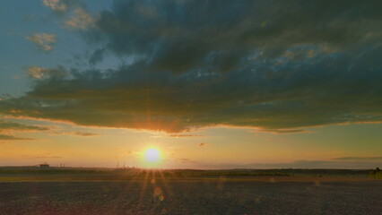 Experience the breathtaking beauty of a serene sunset over a tranquil and picturesque landscape