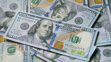 Various Currency Bills are Stacked Together, Highlighting the Prominence of Hundred Dollar Notes