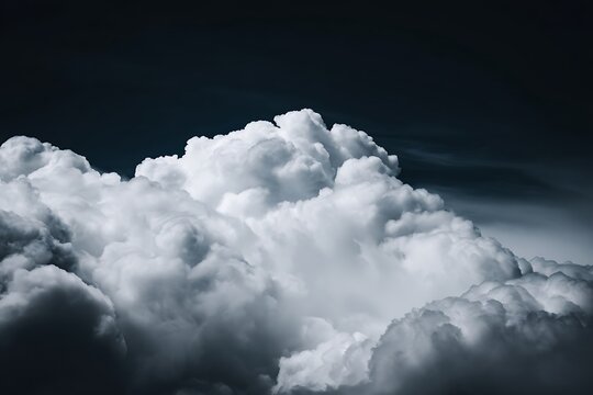 Massive cumulus cloud against dark backdrop