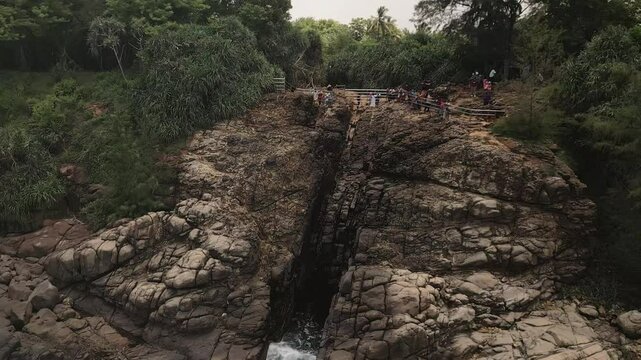 Aerial close up view Hummanaya Blowhole southern coast of Sri Lanka, showcasing powerful ocean spray erupting through coastal rock cliffs near Kudawella village. Famous travel destination in Srilanka
