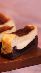 Photo of Burnt Chocolate Melted cake that has been cut and placed on a wooden box stand. Photo with various camera angles 45 degrees, front view and flat lay. Portrait and landscape aspect ratio.
