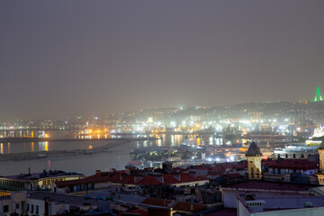 Obraz premium Night view from above of the city of Algiers and Great Mosque of Algiers. Republic of Algeria