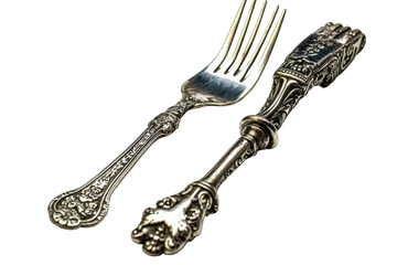 Ornate silver fork and decorative utensil rest against a black background.  Intricate detailing is visible on both pieces, showcasing a vintage aesthetic
