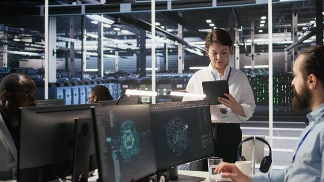 Server hub supervisor overseeing data scientist examining neural network algorithm on screen. Manager reviewing performance dashboards in artificial intelligence infrastructure environment, camera A