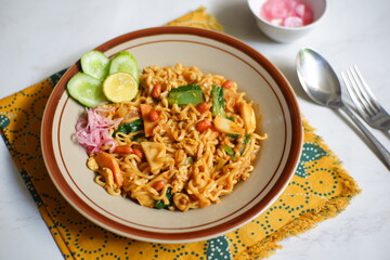 Aceh style fried noodles in a plate
