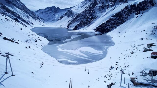 Chair Lift In Andes Mountains Santiago Chile. Skier Skiing Downhill On Empty Ski Slopes In The Mountains. Snowy Countryside Andes Mountains Map Frozen. Snowy Lagoon Nature. Andes Mountains Santiago.