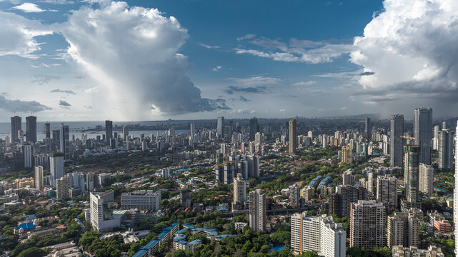 Modern City high-rise skyscraper buildings. Aerial drone view of the Financial District in Mumbai. Beautiful Cloudy weather during monsoon in Mumbai, India. Dadar-Bandra view.