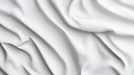 Obraz premium Close-up of white fabric with subtle folds creating flowing texture and shadows
