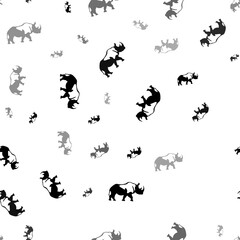 Seamless vector pattern with rhinoceros symbols, creating a creative monochrome background with rotated elements. Illustration on transparent background
