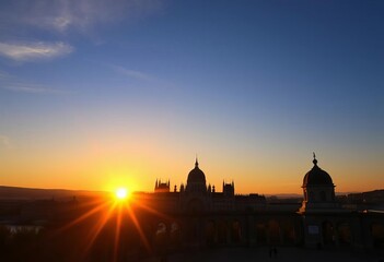 Fototapeta premium Sunrise silhouettes at Fisherman's Bastion viewpoint, Budapest, city, romantic