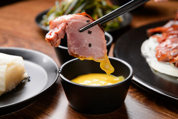 Smoked duck dipped in mustard sauce
