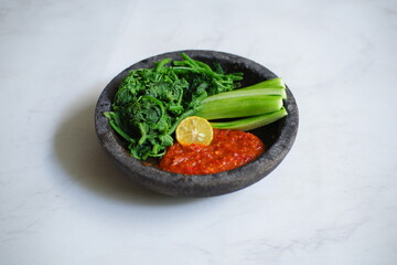 vegetables and sambal on a plate 